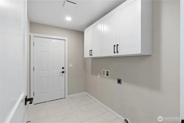 a view of an empty room and wooden floor