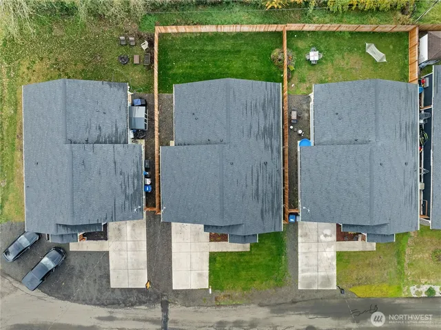 aerial view of a house with a yard