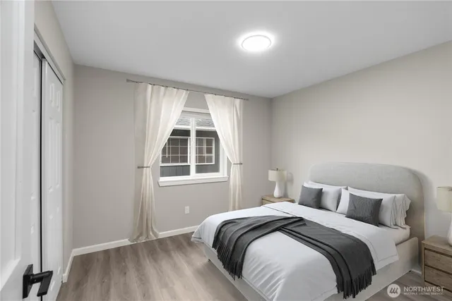 a bedroom with a bed and a window