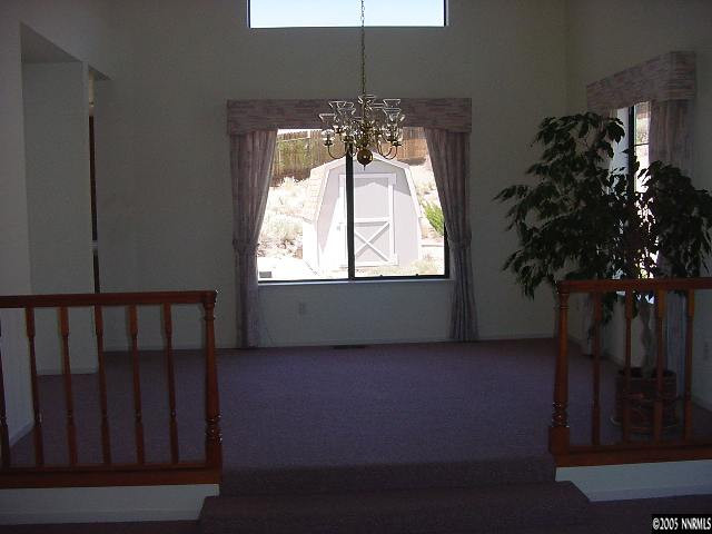 5301 Simons Drive Reno, NV 89523 - Photo 6 of 8 a room with window and a chandelier