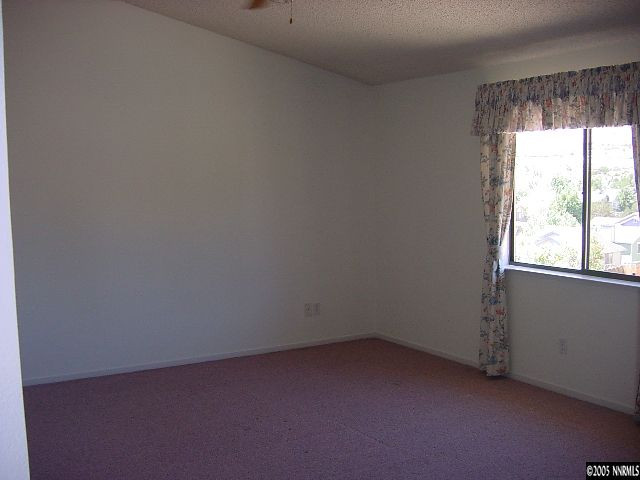 5301 Simons Drive Reno, NV 89523 - Photo 7 of 8 an empty room with a window