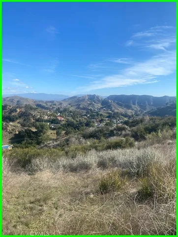 a view of a city with lush green forest