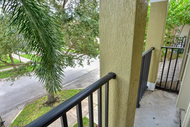 a view of a balcony with wooden floor