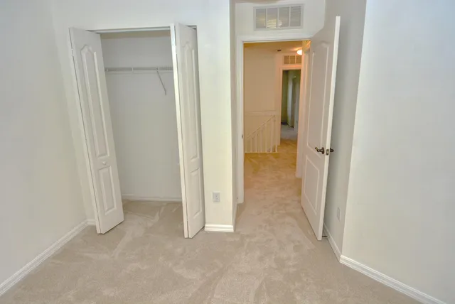 a view of a room with a hallway and toilet