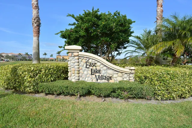 a view of a garden with a building in the background