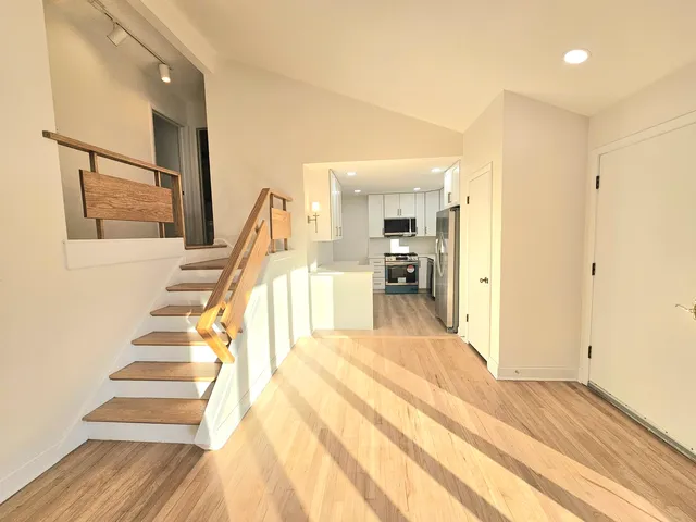 a view of a living room and entryway