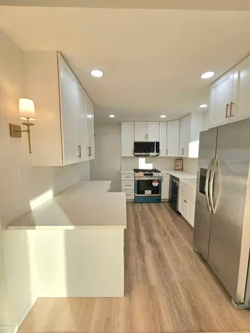 a bathroom with a sink and cabinets