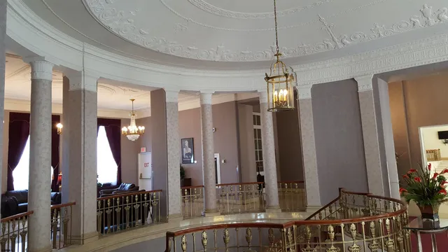 a view of a chandelier in a hall with a chandelier