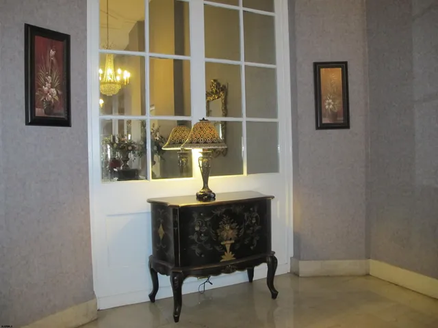 a view of a swimming pool with furniture