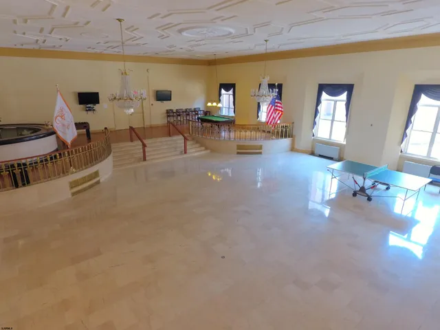 a room with a table and chairs