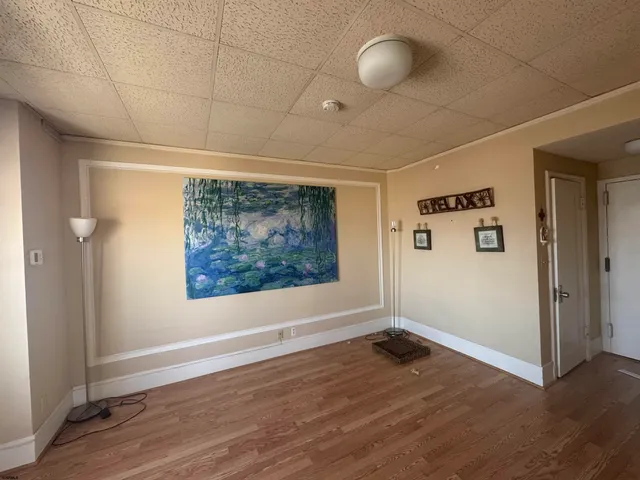 a view of livingroom with hardwood floor and window