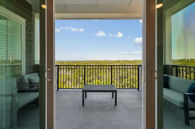 a view of balcony with furniture