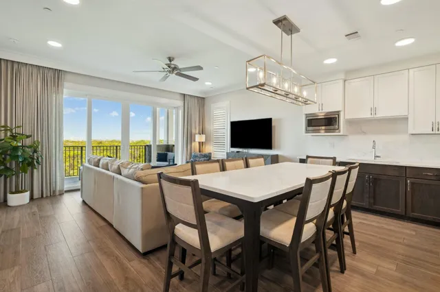 a large kitchen with a table and chairs