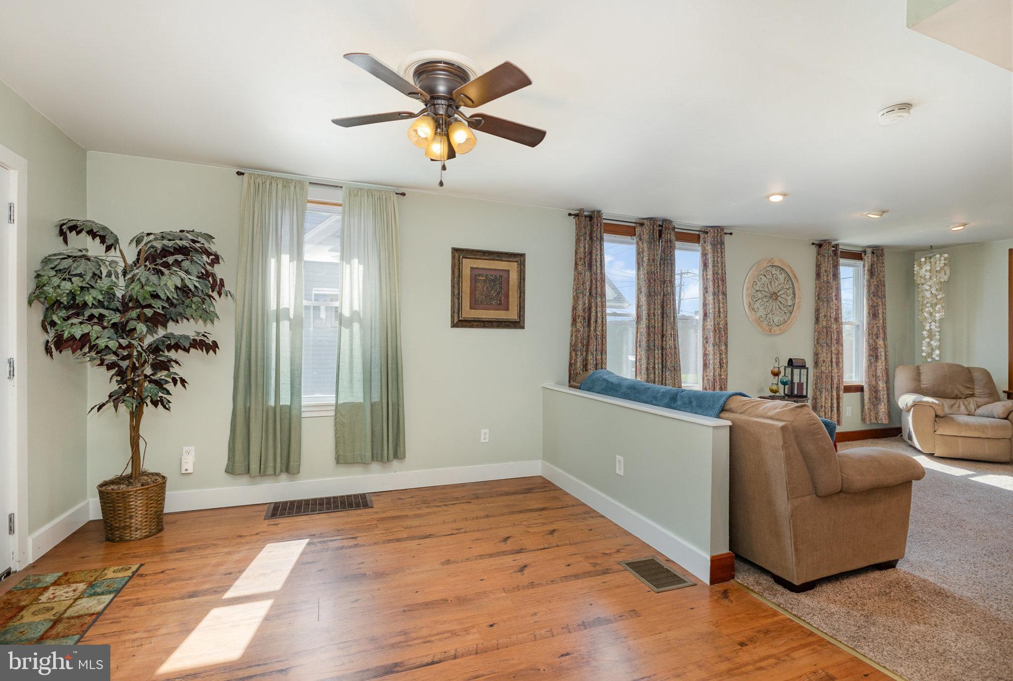 384 High Street Highspire, PA 17034 - Photo 12 of 35 a living room with furniture and potted plant
