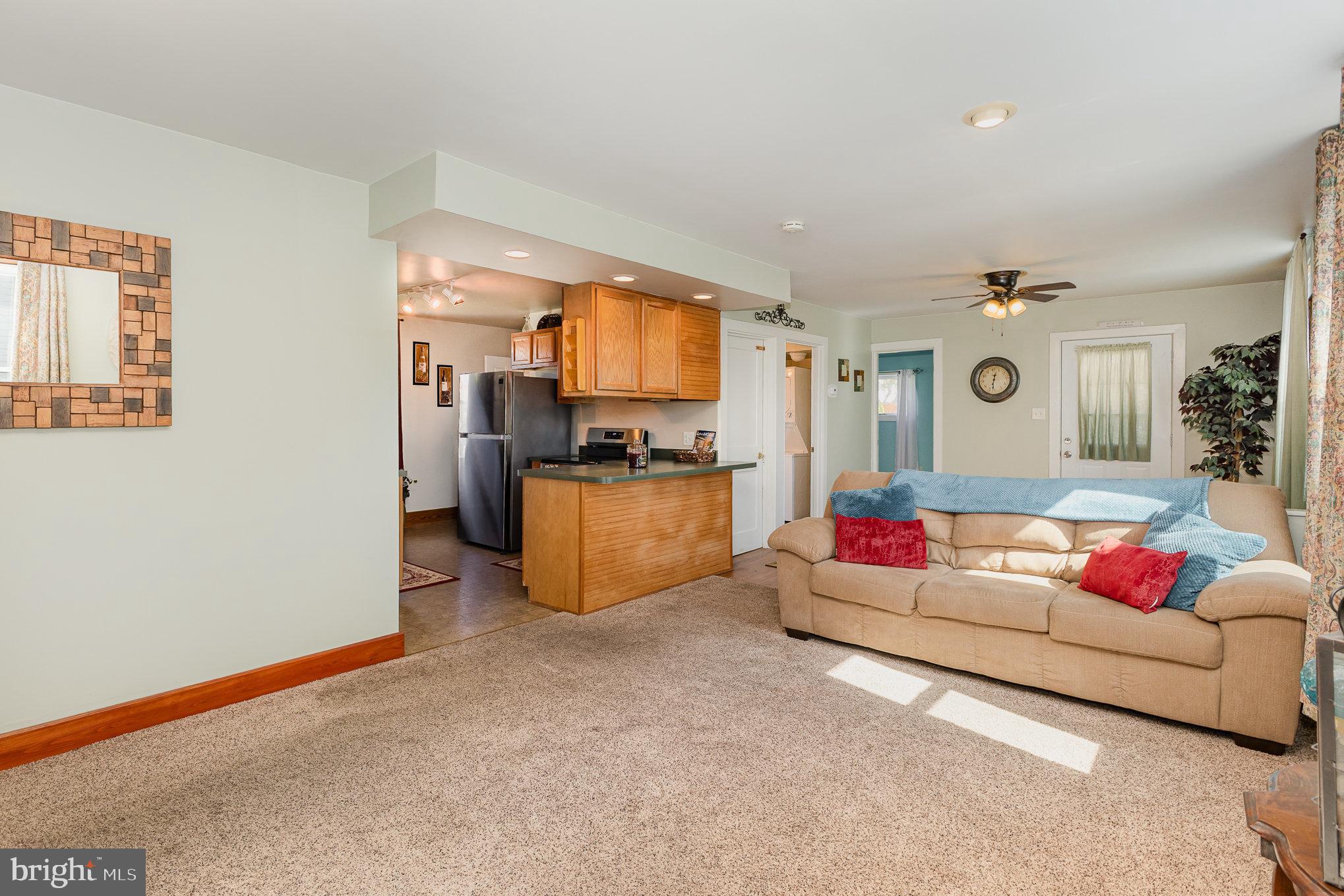 384 High Street Highspire, PA 17034 - Photo 13 of 35 a living room with furniture and kitchen view