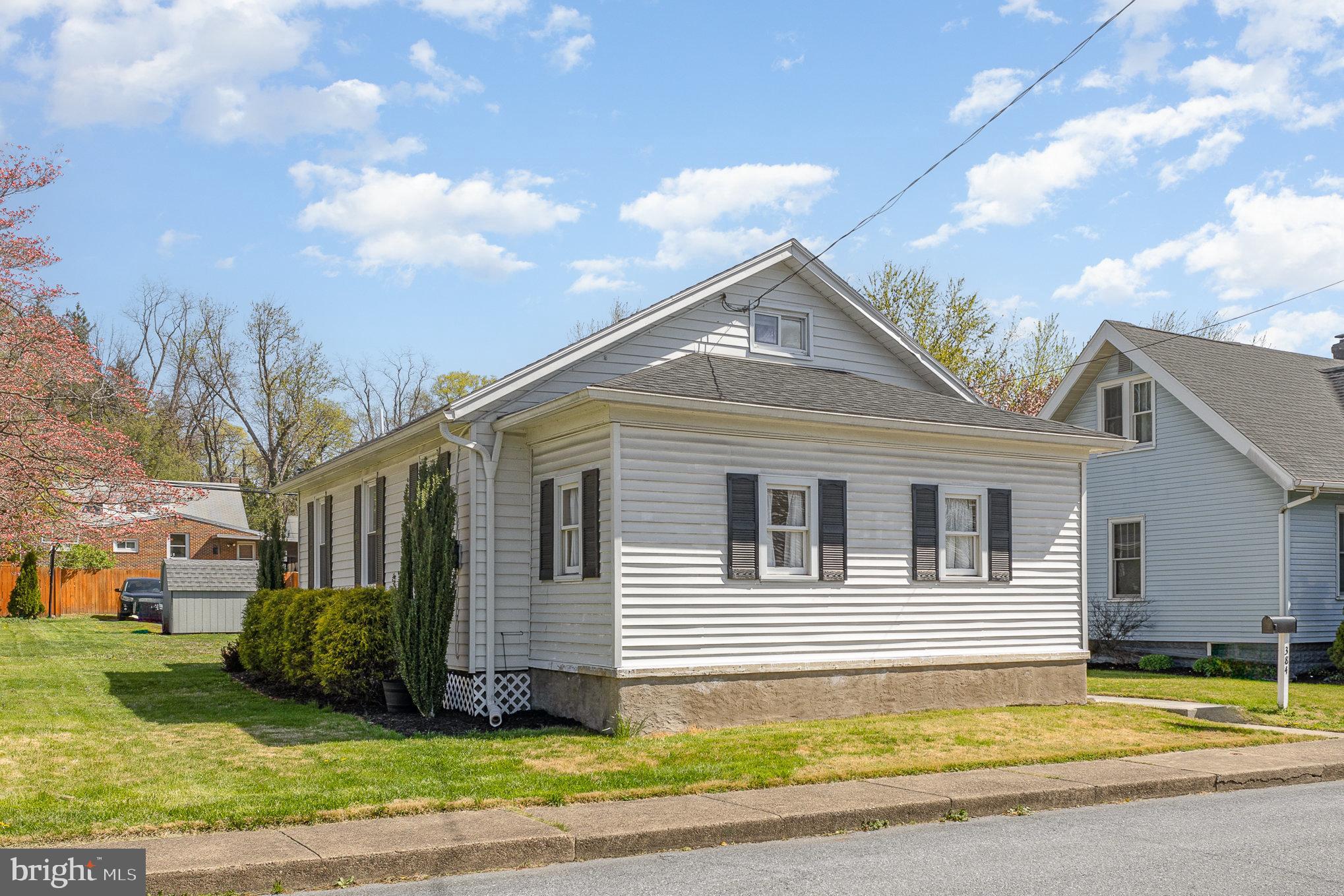 384 High Street Highspire, PA 17034 - Photo 3 of 35 a view of a house with a garden and pathway