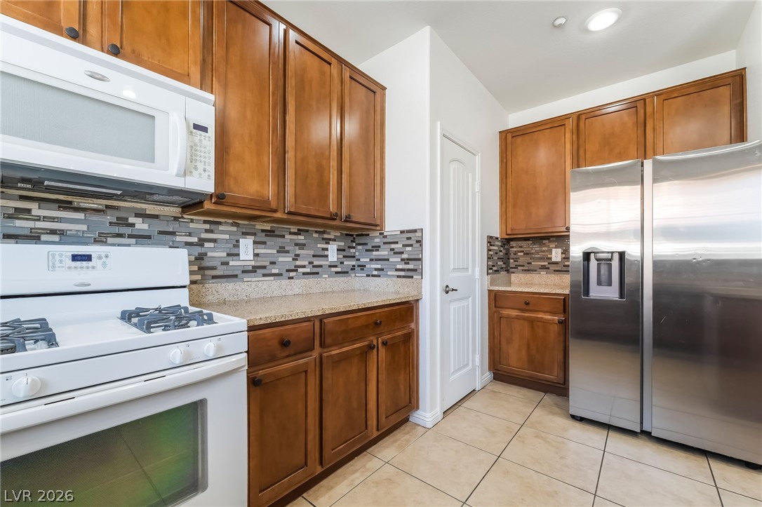 3175 Via Seranova Henderson, NV 89044 - Photo 16 of 45 This functional kitchen provides a practical and inviting space for culinary endeavors.