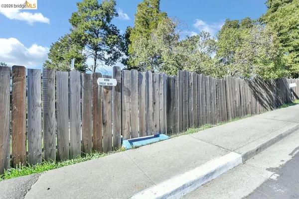 a backyard of a house with trees