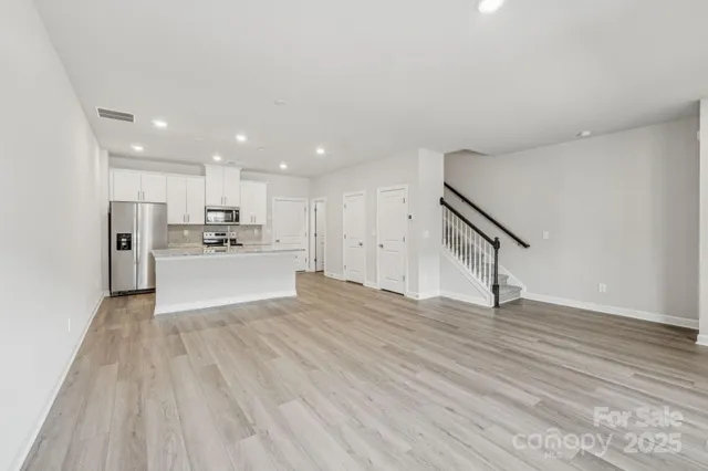 a view of kitchen with wooden floor