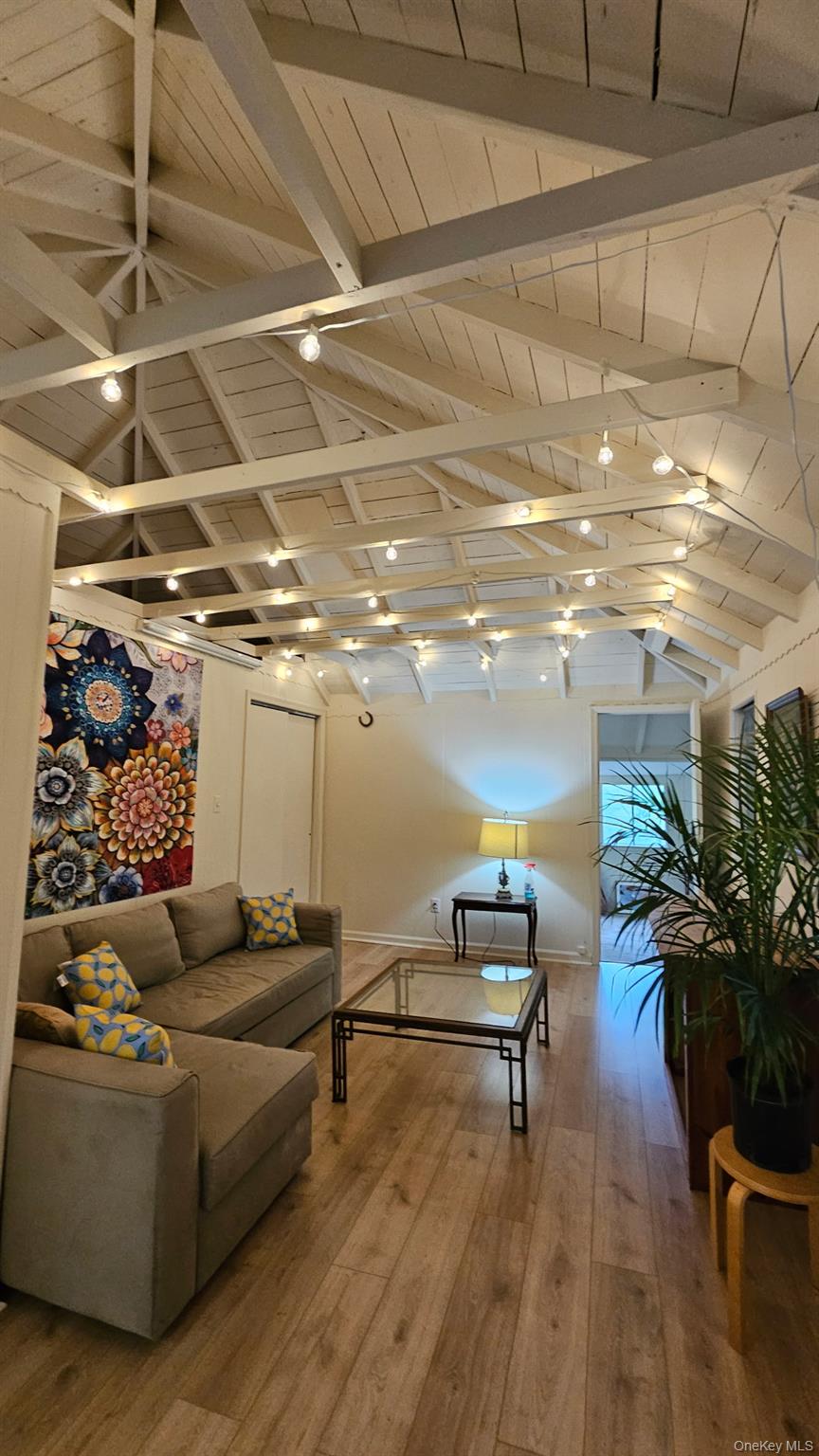 71 Miller Road, Unit 25 Hopewell Junction, NY 12533 - Photo 2 of 10 a living room with furniture and a flat screen tv