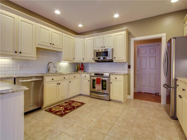 639 Fellowship Road Mount Juliet, TN 37122 - Photo 7 of 17 Newly renovated kitchen with new tile flooring, granite countertops, new fixtures and hardware plus recessed lighting