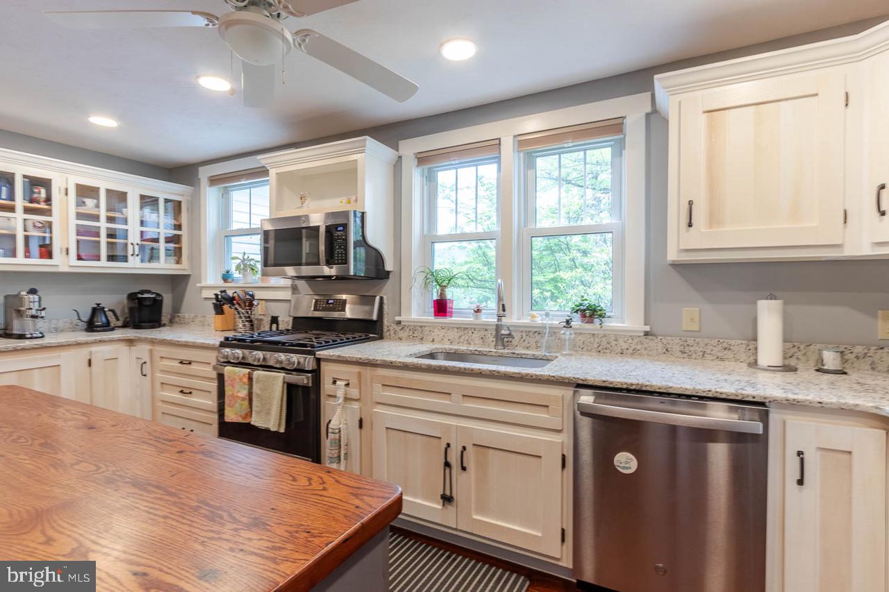 1834 Decker Hollow Road Tyrone, PA 16686 - Photo 19 of 40 a kitchen with stainless steel appliances granite countertop a stove sink and cabinets