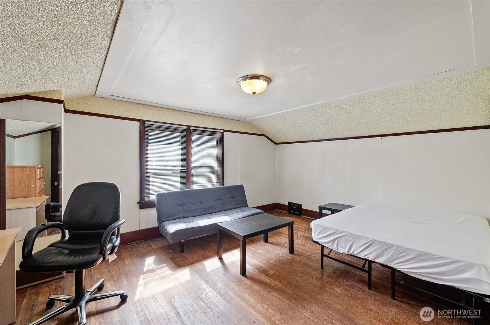 5016 7th Avenue Northeast Seattle, WA 98105 - Photo 13 of 36 a living room with furniture and a window