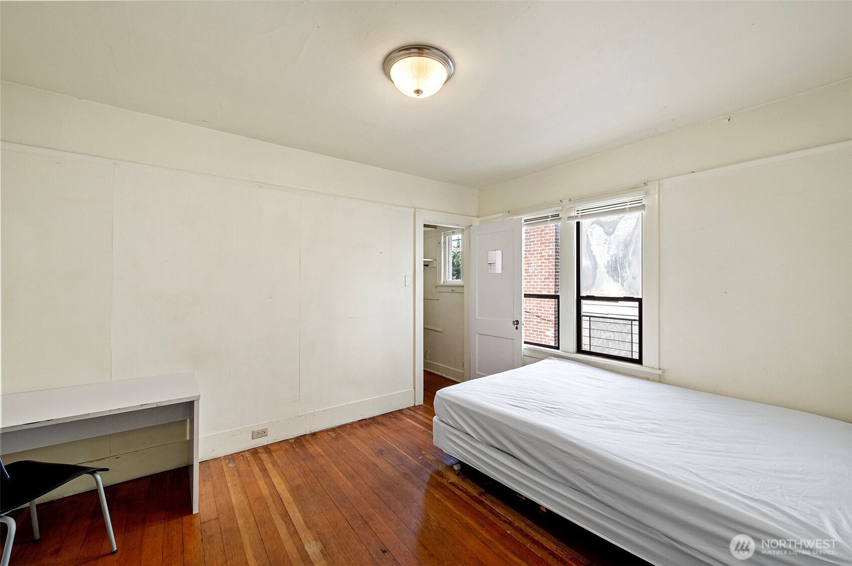 5016 7th Avenue Northeast Seattle, WA 98105 - Photo 19 of 36 a bedroom with a bed and a window