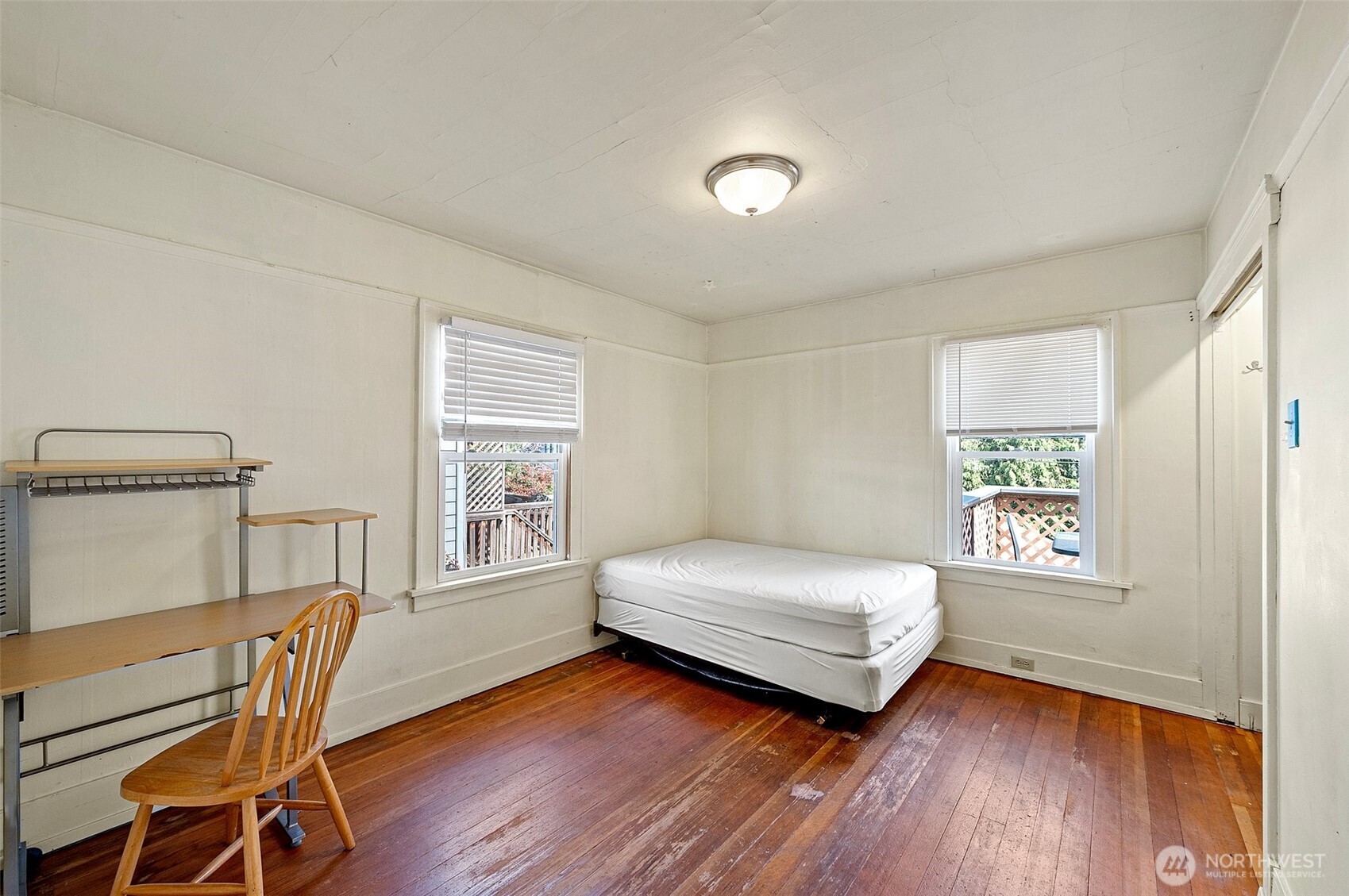 5016 7th Avenue Northeast Seattle, WA 98105 - Photo 21 of 36 a bedroom with a bed and a window