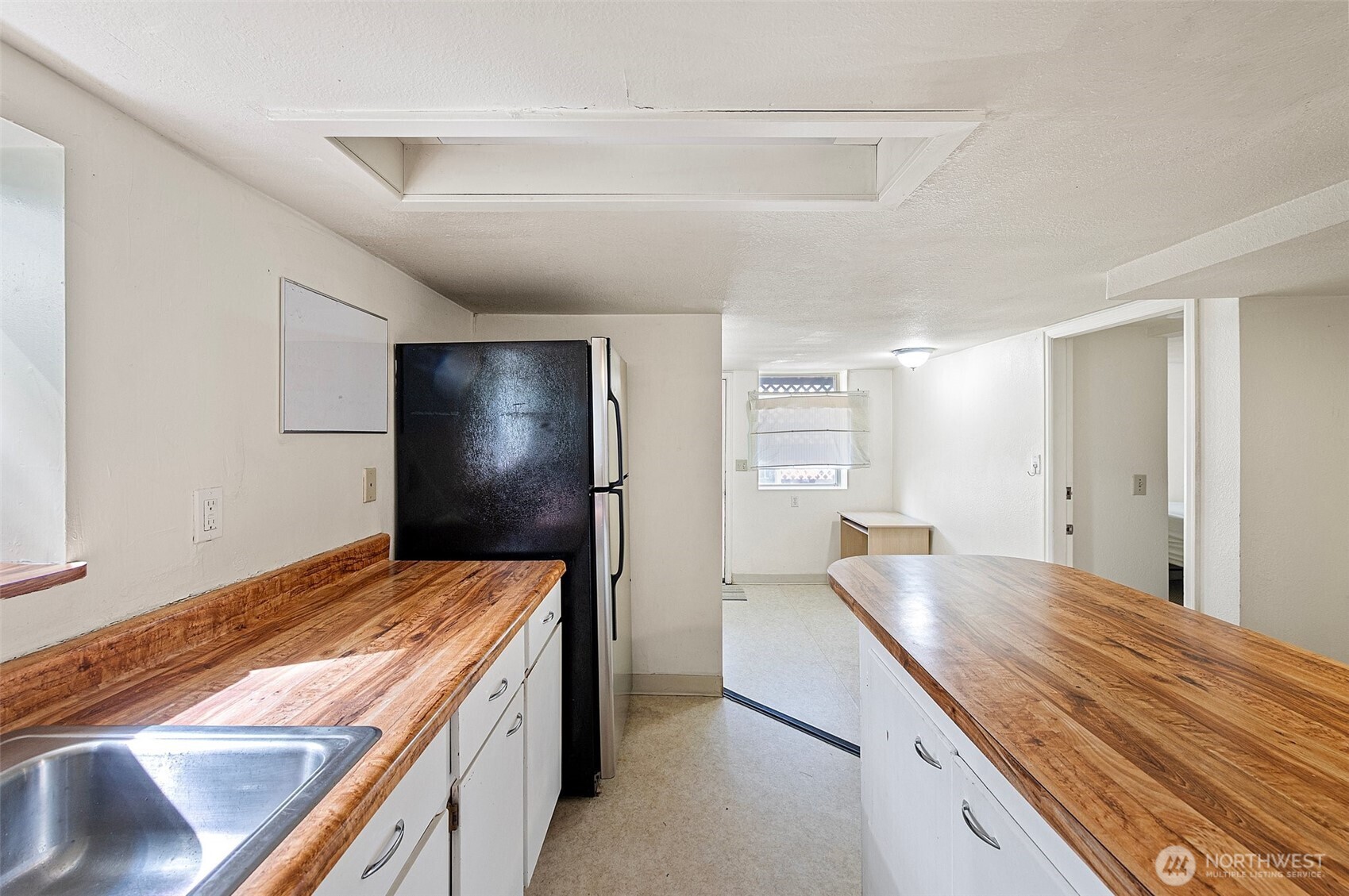 5016 7th Avenue Northeast Seattle, WA 98105 - Photo 25 of 36 a kitchen with a stove and refrigerator