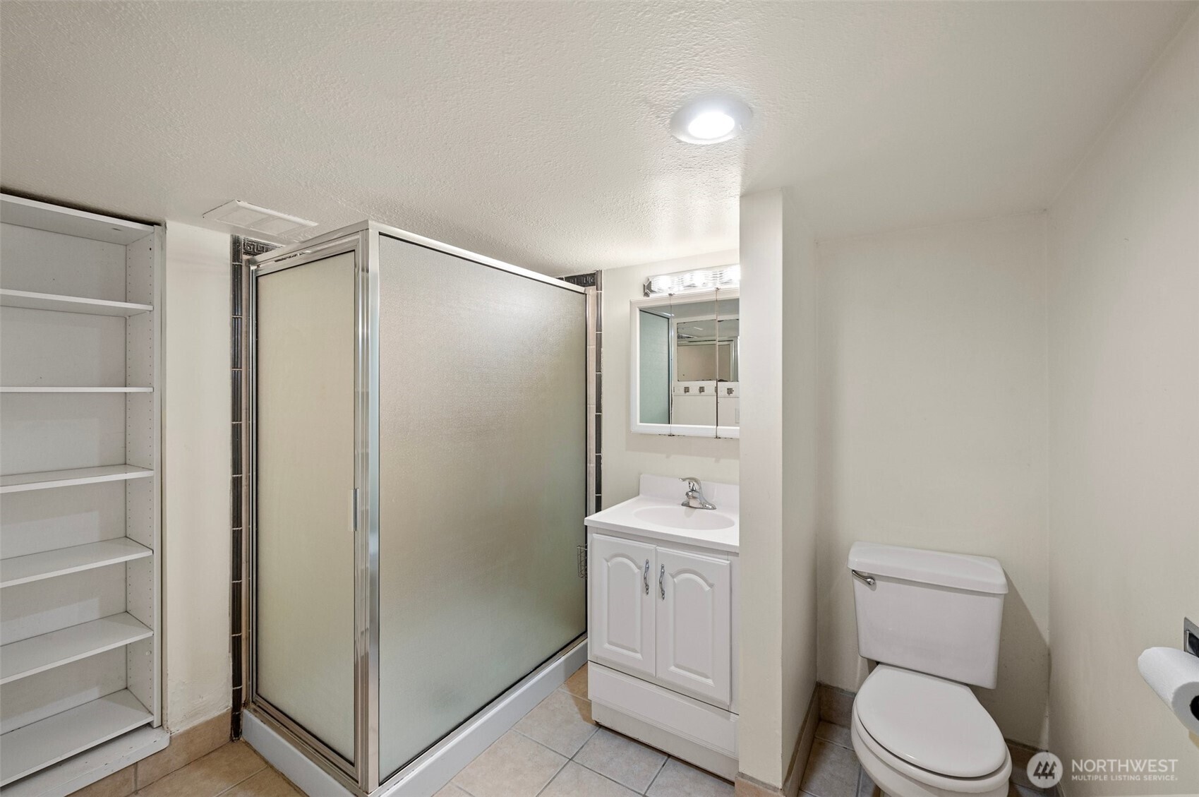 5016 7th Avenue Northeast Seattle, WA 98105 - Photo 30 of 36 a bathroom with a toilet a sink and shower