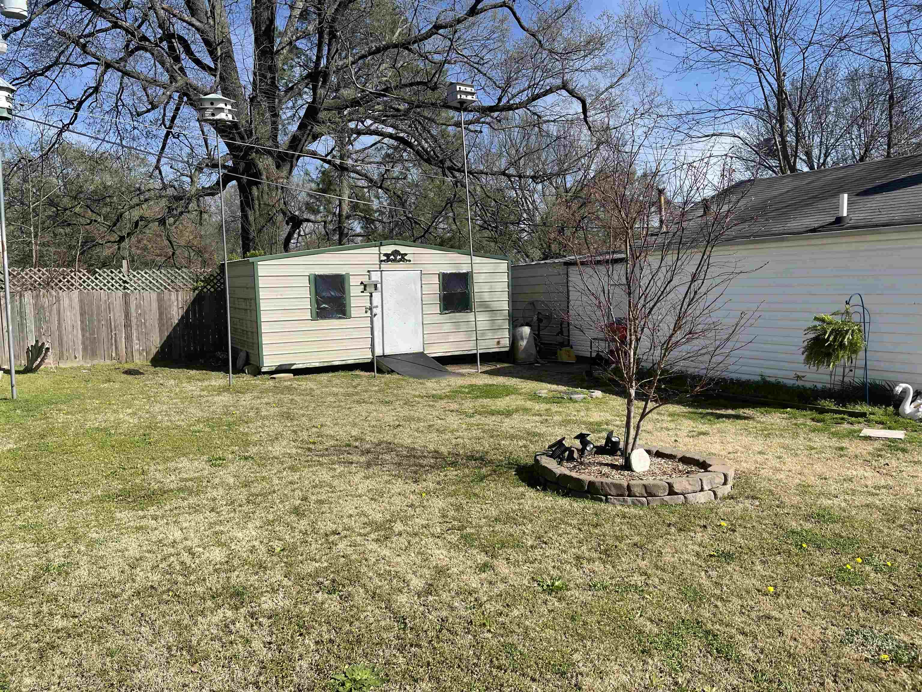 2346 Imogene Street Memphis, TN 38114 - Photo 14 of 16 a view of a backyard with a tree