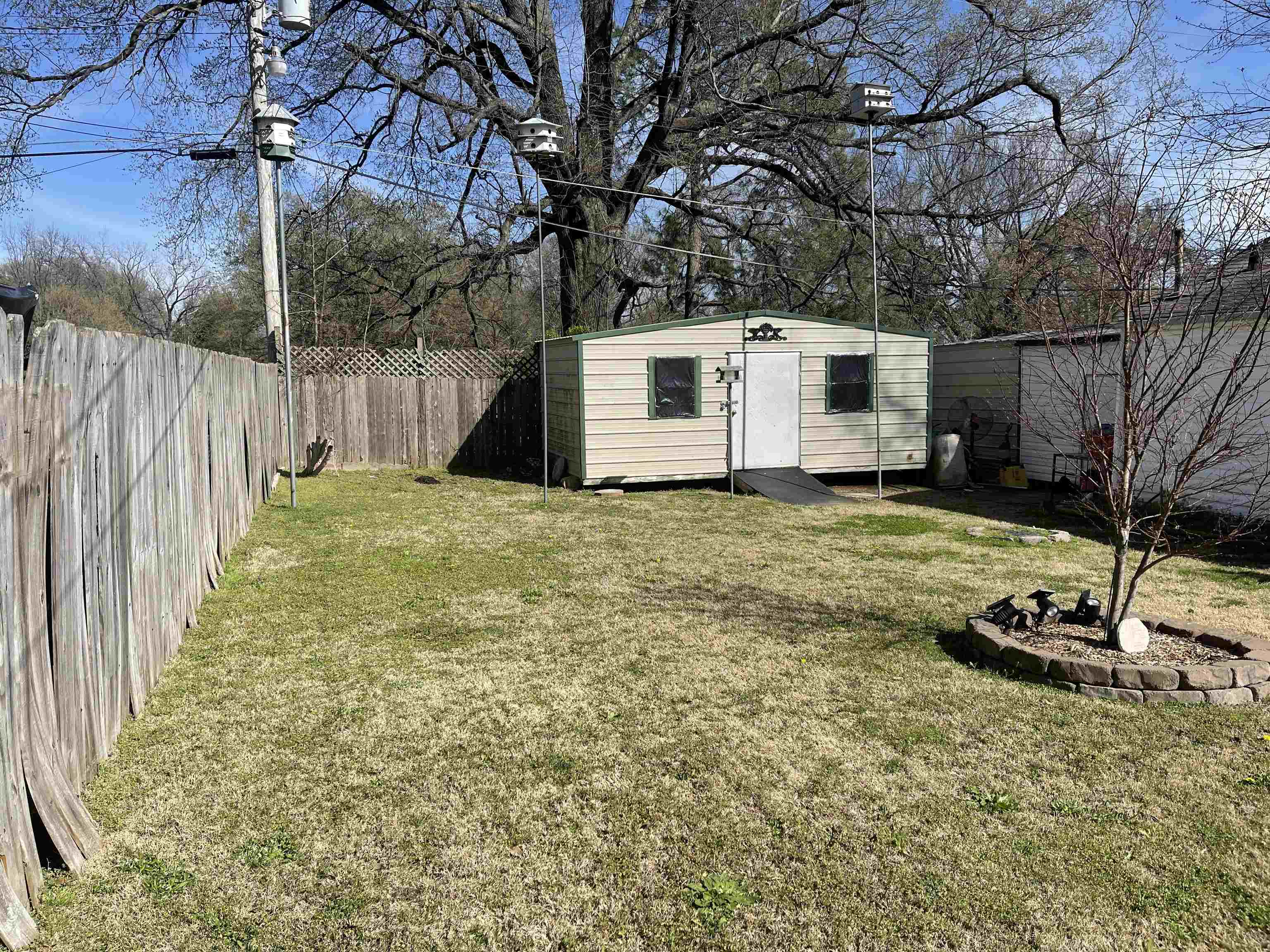 2346 Imogene Street Memphis, TN 38114 - Photo 15 of 16 a view of a backyard with a small cabin