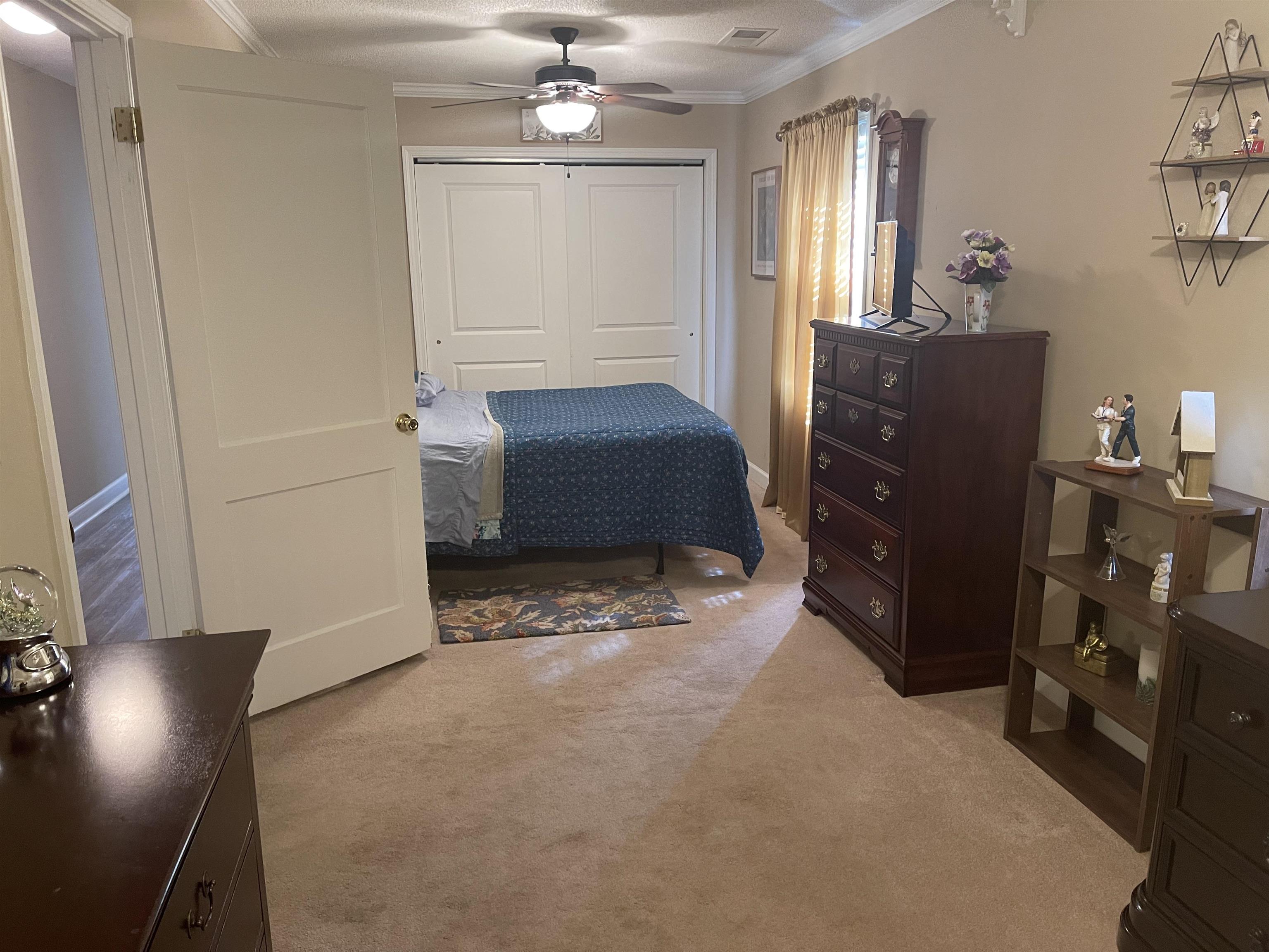 2346 Imogene Street Memphis, TN 38114 - Photo 10 of 16 a bedroom with a bed and wooden floor