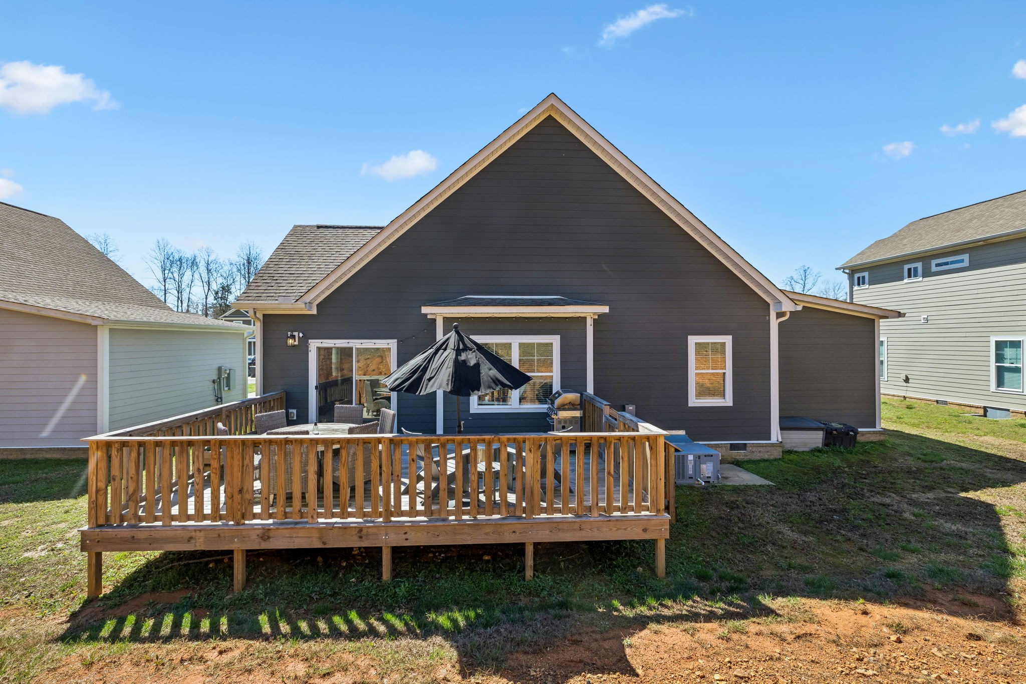20 Sycamore Ridge West Burns, TN 37029 - Photo 37 of 38 a view of a house with wooden deck and furniture