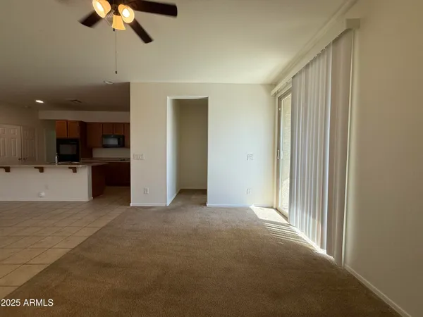 a view of a kitchen with a sink and cabinets