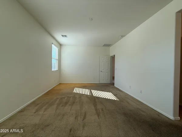 a view of an empty room and window