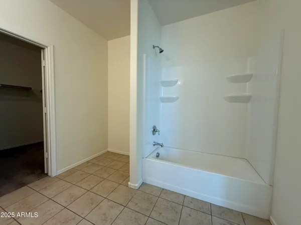 a white bath tub sitting in a bathroom
