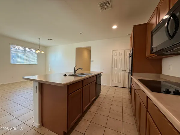 a kitchen with a sink and cabinets