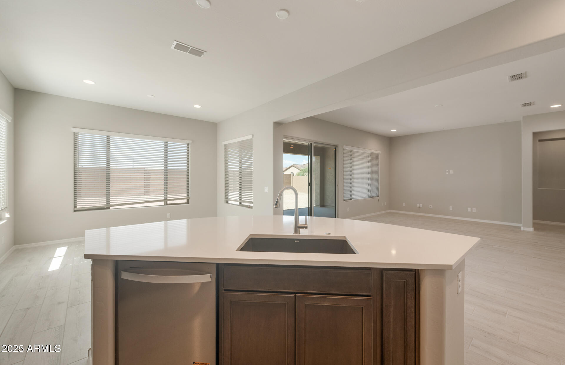 7802 West Mockingbird Way Florence, AZ 85132 - Photo 11 of 34 a kitchen with a sink cabinets and window