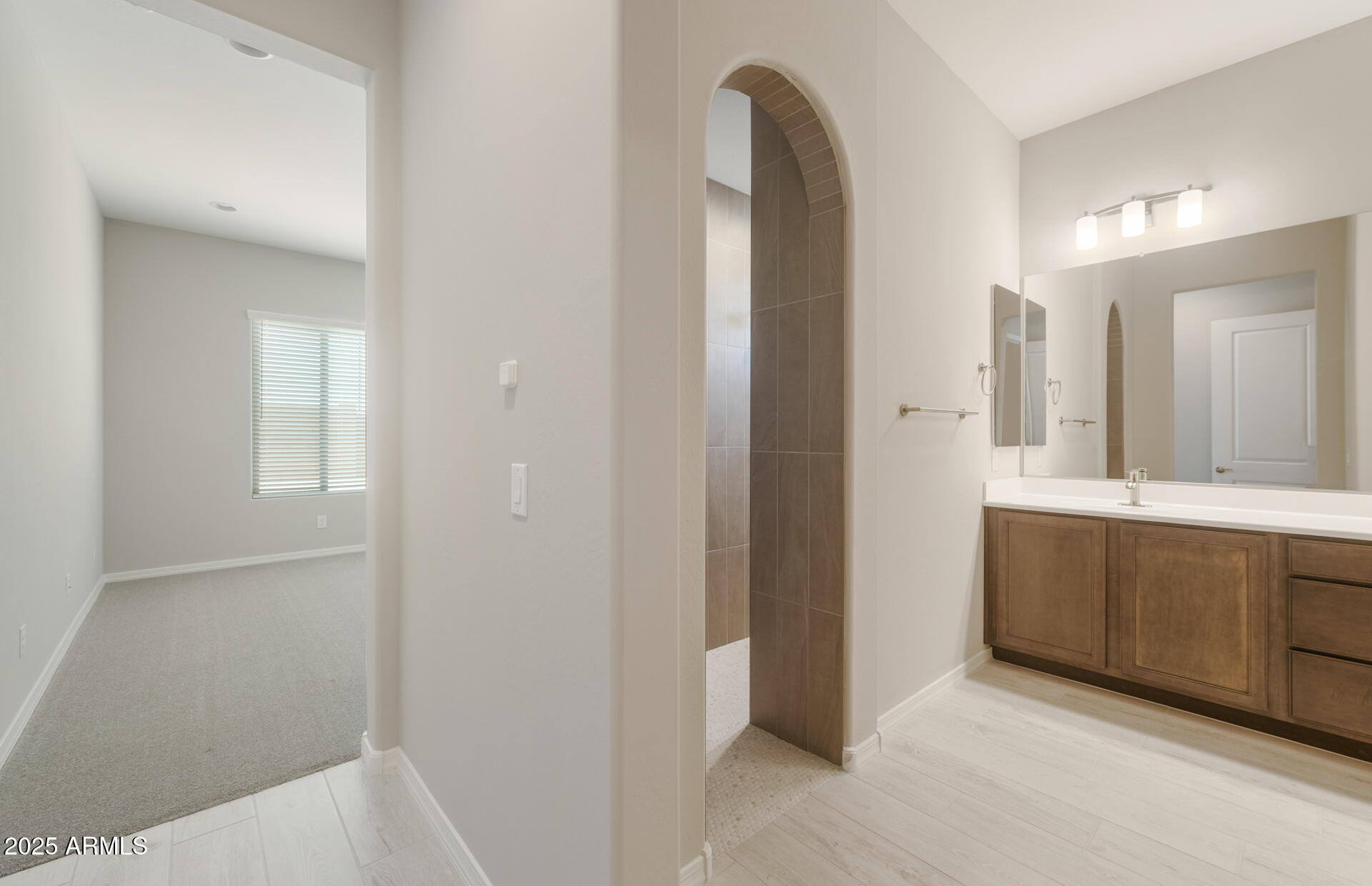 7802 West Mockingbird Way Florence, AZ 85132 - Photo 18 of 34 a spacious bathroom with a mirror