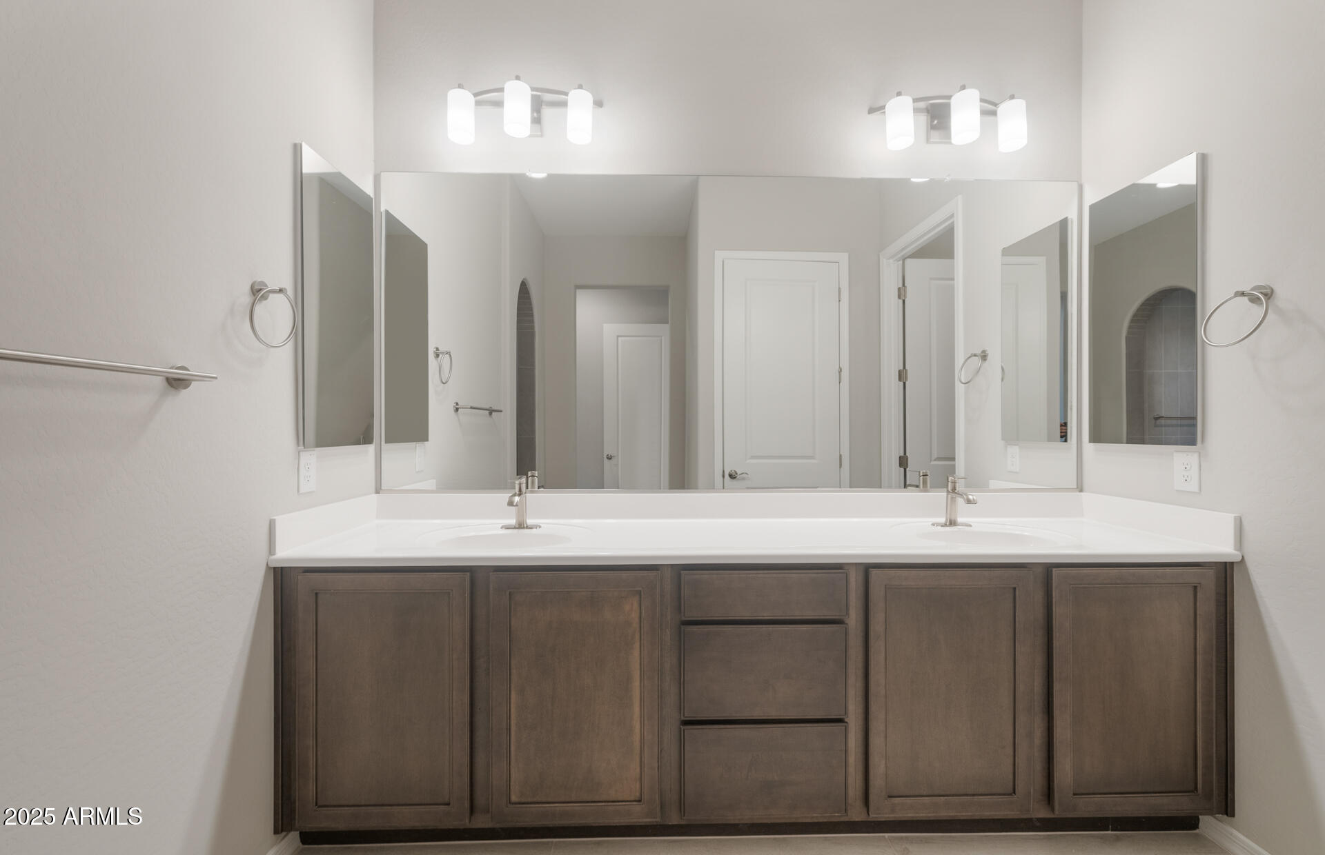 7802 West Mockingbird Way Florence, AZ 85132 - Photo 21 of 34 a bathroom with a double vanity sink and a mirror