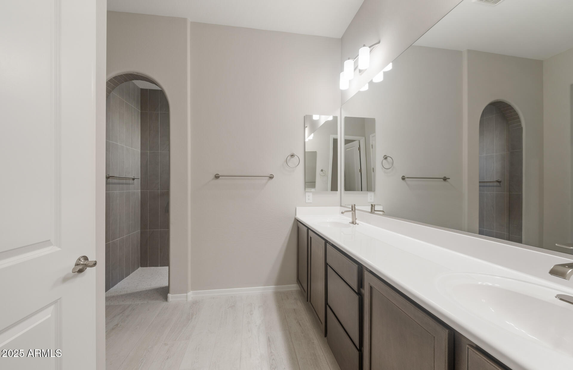7802 West Mockingbird Way Florence, AZ 85132 - Photo 22 of 34 a bathroom with a double vanity sink and a mirror