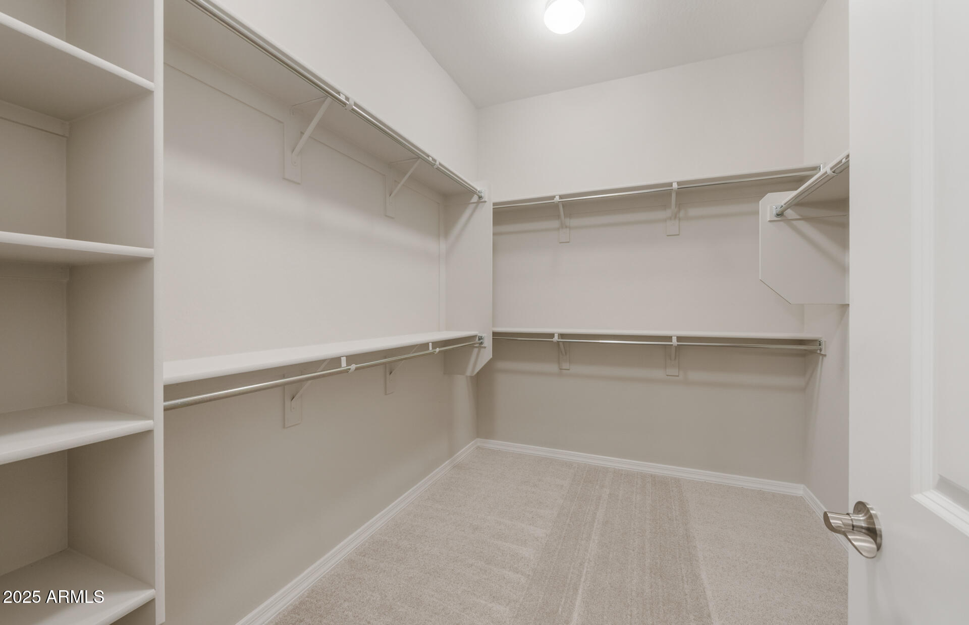 7802 West Mockingbird Way Florence, AZ 85132 - Photo 23 of 34 a view of an empty walk in closet