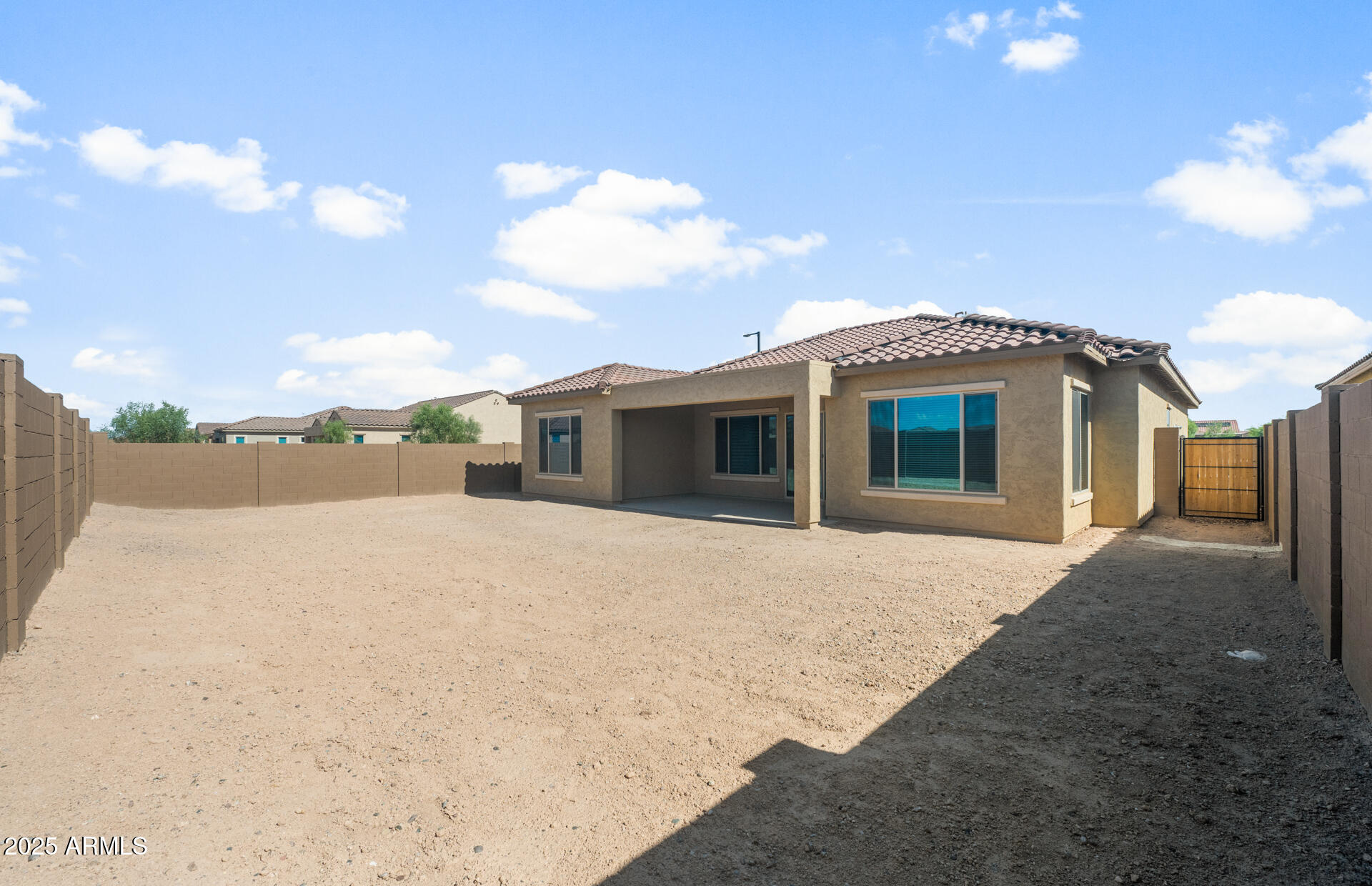 7802 West Mockingbird Way Florence, AZ 85132 - Photo 24 of 34 a front view of a house with a yard and garage