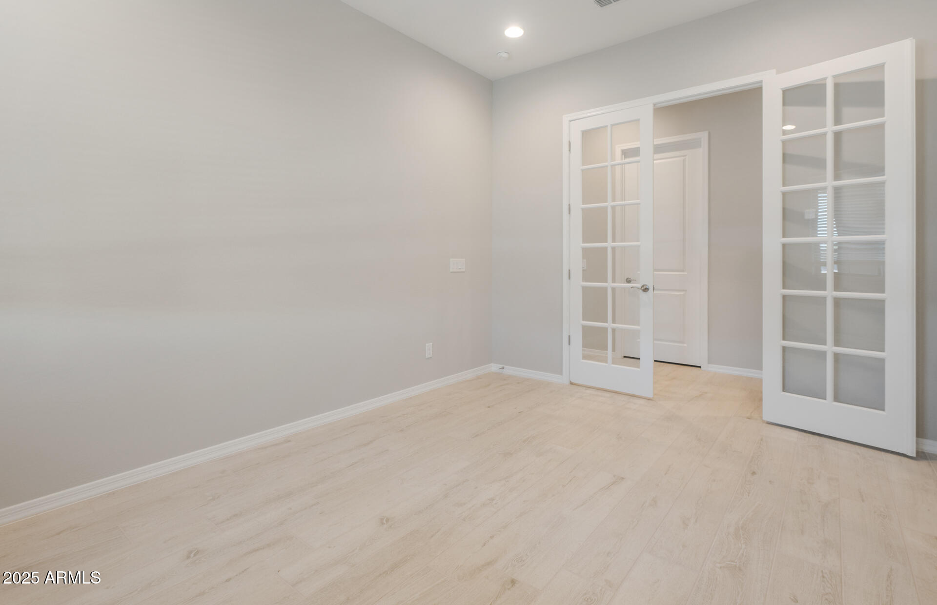 7802 West Mockingbird Way Florence, AZ 85132 - Photo 2 of 34 an empty room with a empty space and windows