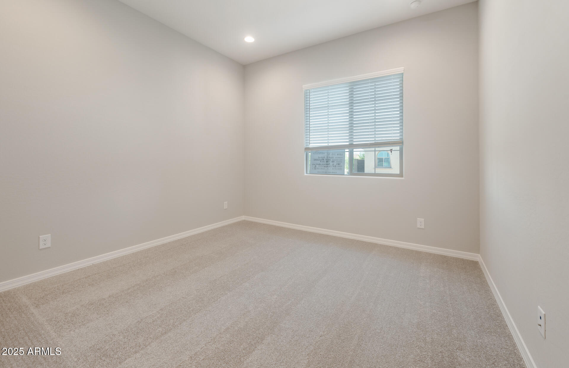 7802 West Mockingbird Way Florence, AZ 85132 - Photo 3 of 34 an empty room with a window