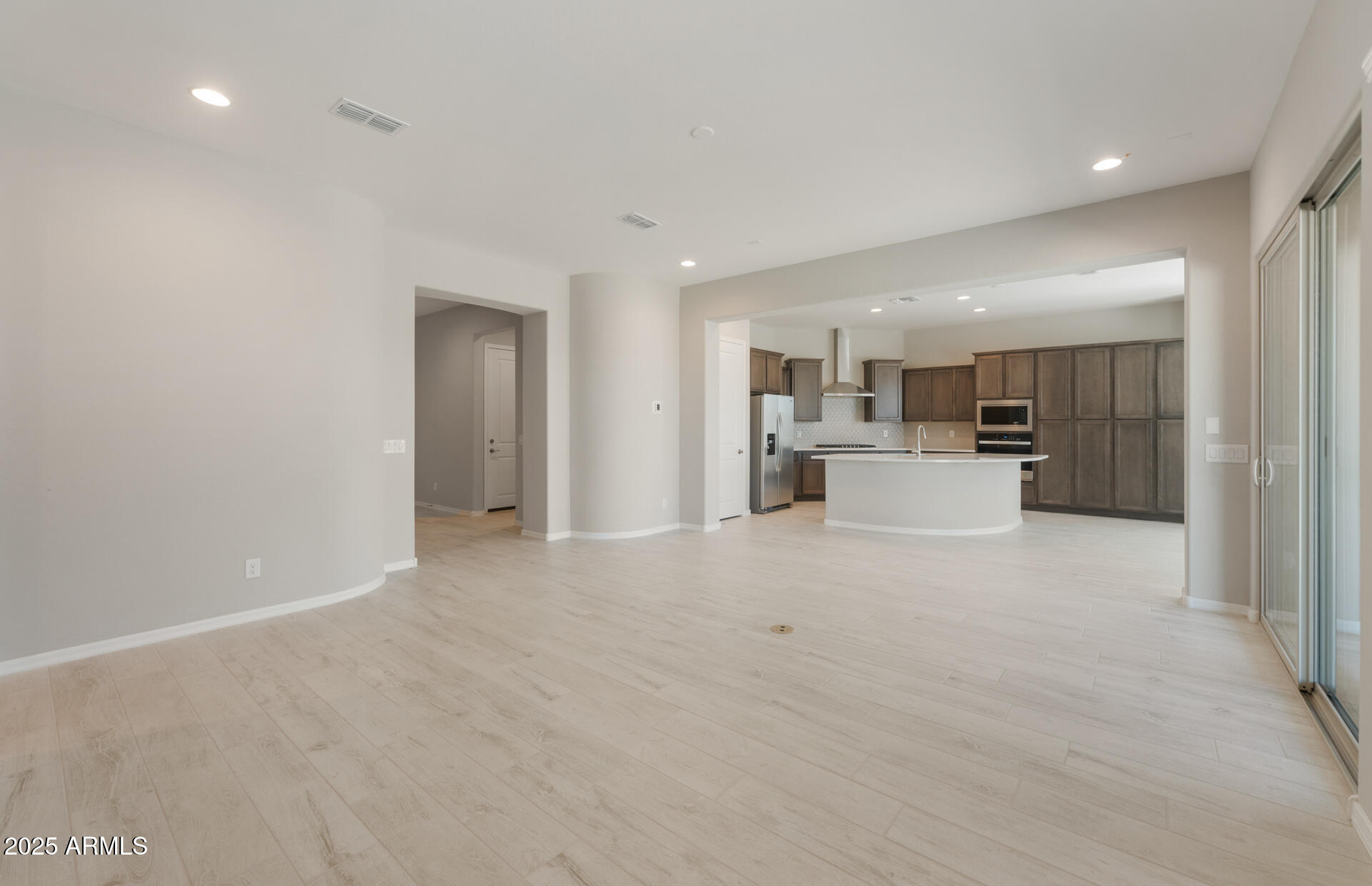 7802 West Mockingbird Way Florence, AZ 85132 - Photo 5 of 34 a view of a kitchen with refrigerator and a sink