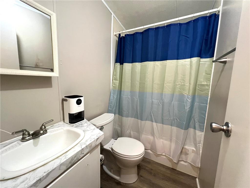 1175 Bartow Street Waleska, GA 30183 - Photo 16 of 25 a bathroom with a sink a toilet and shower