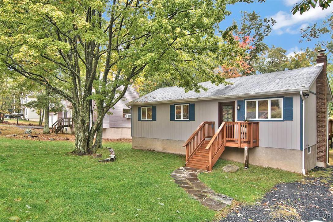 4280 Pne Rdg Drive Bushkill, PA 18324 - Photo 2 of 32 front view of a house with a yard